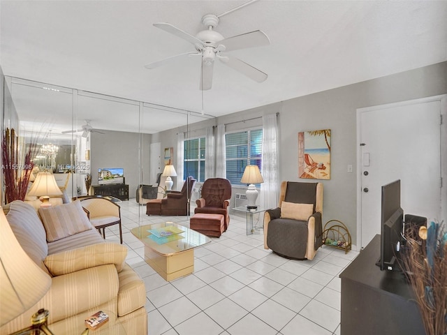 living area featuring light tile patterned floors and ceiling fan