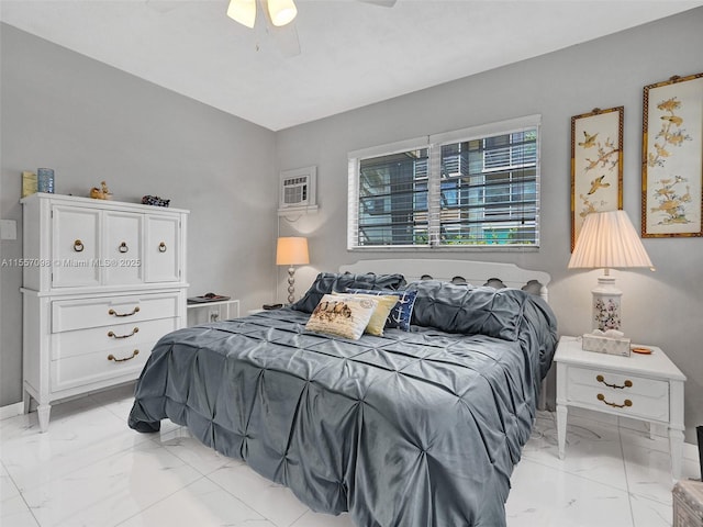 bedroom featuring marble finish floor and a ceiling fan