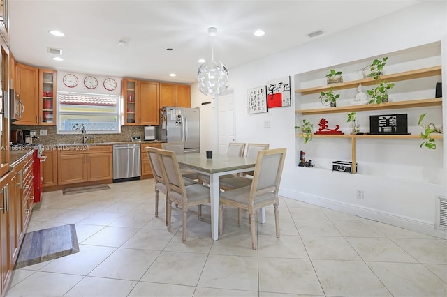 tiled dining area featuring sink