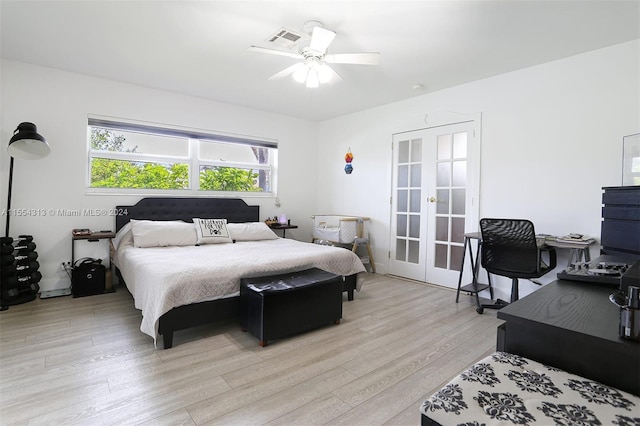 bedroom featuring light hardwood / wood-style floors, french doors, and ceiling fan