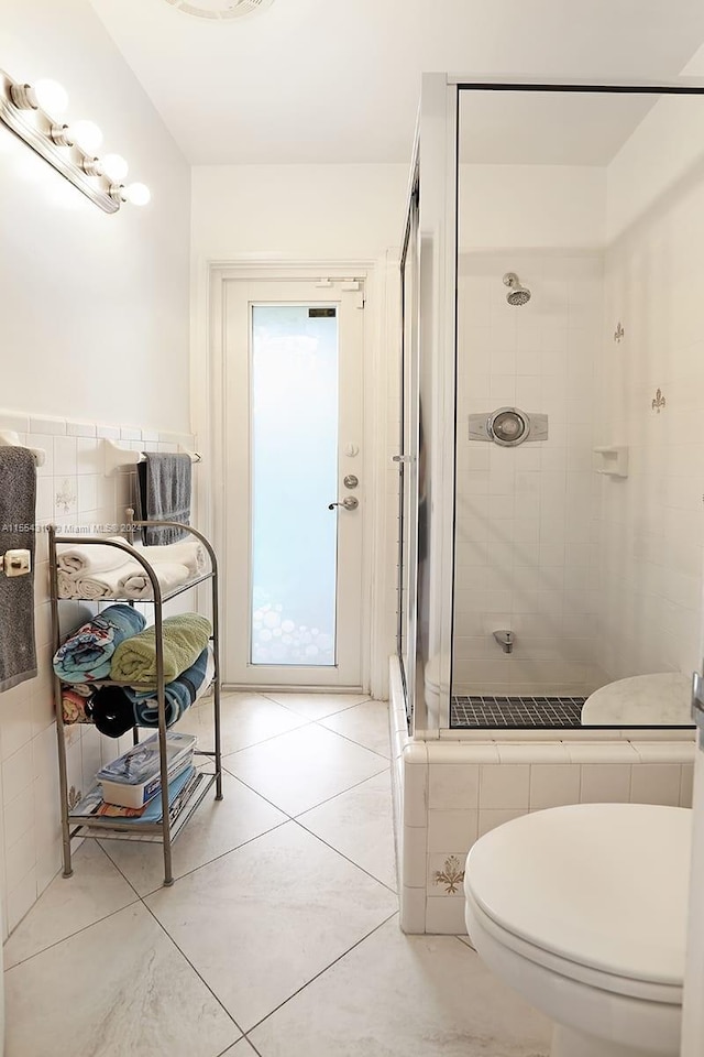 bathroom with walk in shower and toilet