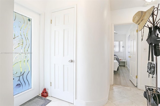 foyer featuring light tile patterned floors