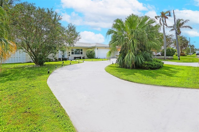 view of home's community with a yard