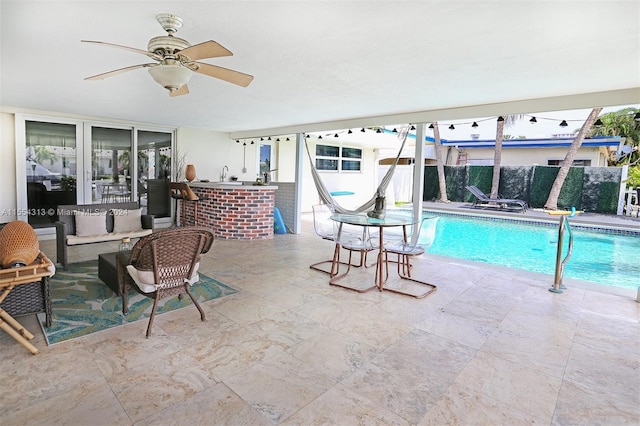 view of pool with ceiling fan