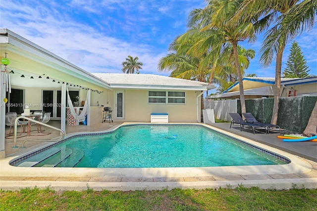 view of swimming pool featuring a patio area