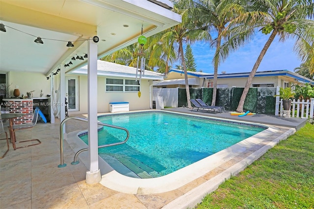 view of pool featuring a patio