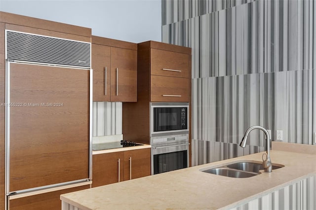 kitchen with sink and built in appliances