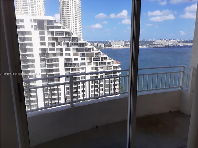 balcony featuring a water view