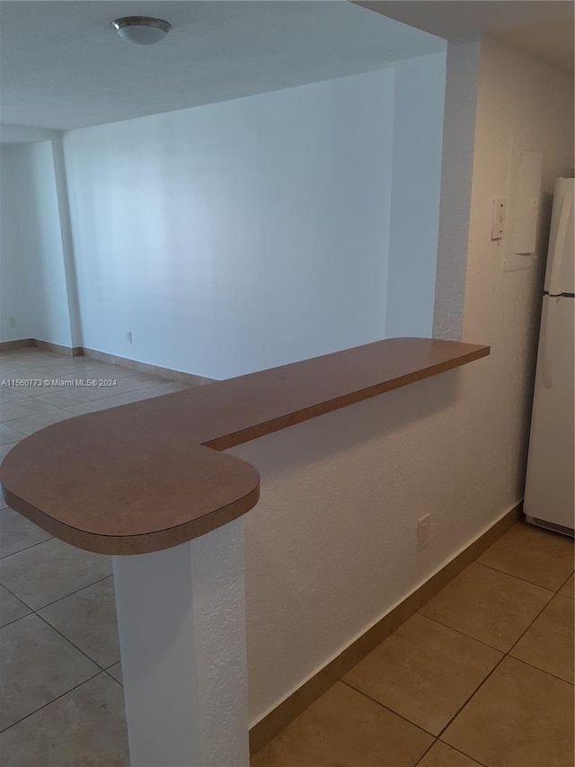 interior space featuring light tile flooring