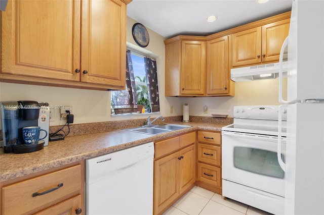 kitchen featuring sink, light tile patterned floors, and white appliances