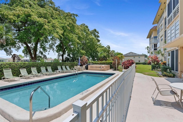 view of swimming pool featuring a patio