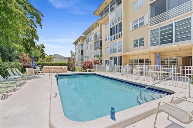 view of swimming pool with a patio