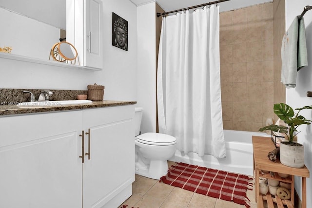 full bathroom with vanity, tile floors, toilet, and shower / bath combo with shower curtain