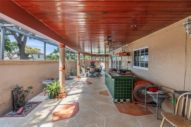 view of terrace featuring ceiling fan