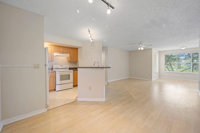 kitchen with ceiling fan, light hardwood / wood-style floors, a textured ceiling, rail lighting, and white range with electric stovetop