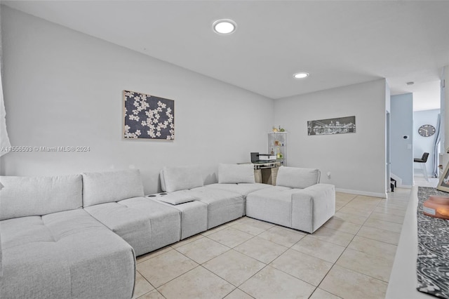 living room featuring light tile floors