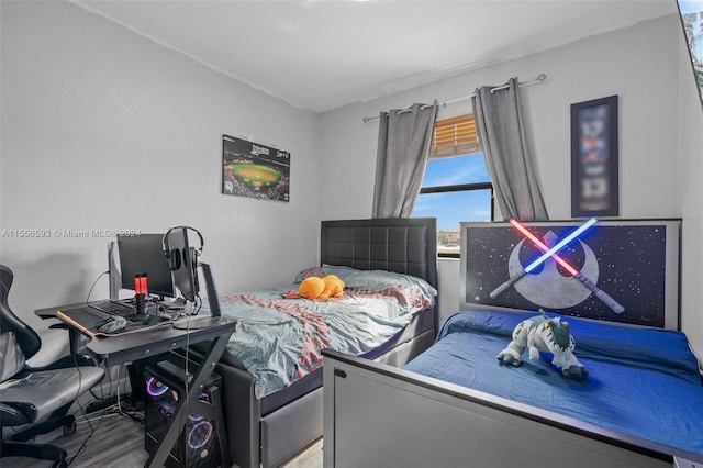 bedroom featuring hardwood / wood-style flooring