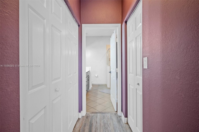 hall with light hardwood / wood-style floors