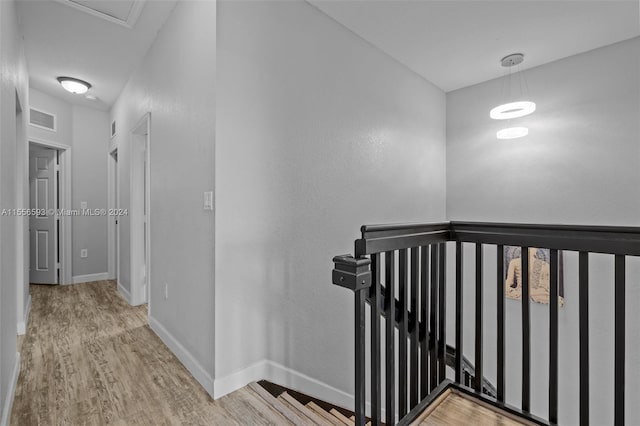 corridor with light wood-type flooring