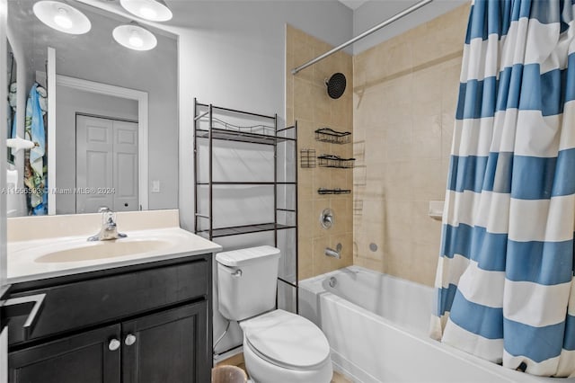 full bathroom featuring toilet, shower / tub combo with curtain, and oversized vanity