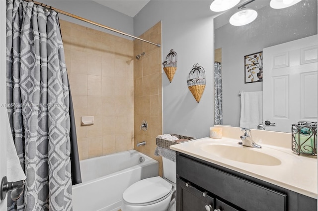 full bathroom featuring shower / tub combo, large vanity, and toilet