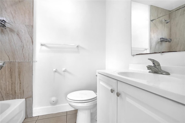 full bathroom featuring tile flooring, toilet, vanity, and tiled shower / bath