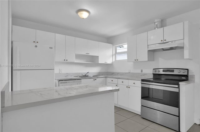 kitchen with light tile floors, white appliances, white cabinets, light stone counters, and sink