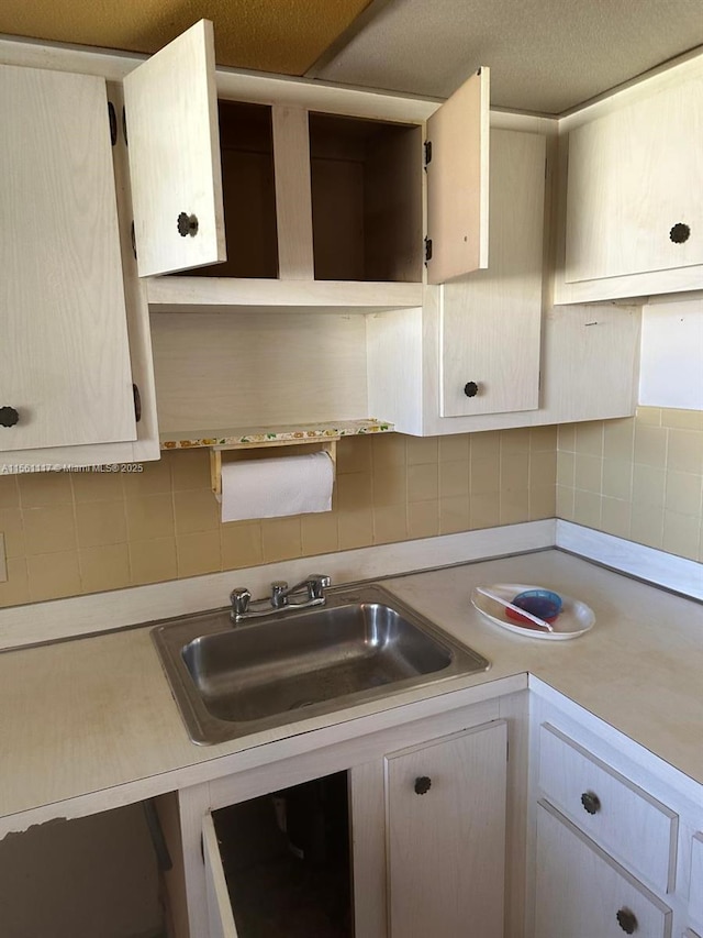 kitchen with tasteful backsplash and sink