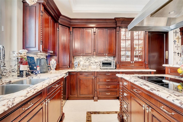 kitchen with a tray ceiling, tasteful backsplash, light tile floors, and light stone counters