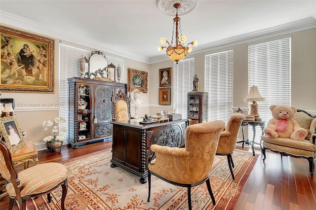 home office with ornamental molding, a notable chandelier, and light hardwood / wood-style flooring