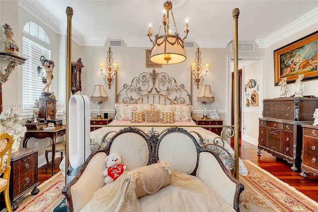 bedroom featuring ornamental molding, a notable chandelier, and dark hardwood / wood-style flooring