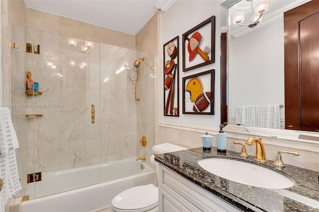 full bathroom with vanity, an inviting chandelier, tiled shower / bath, toilet, and ornamental molding