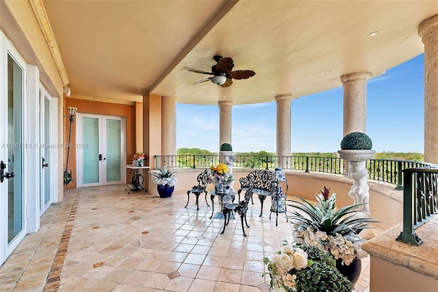 view of patio / terrace with a balcony and ceiling fan