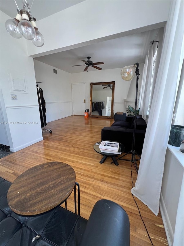 interior space with ceiling fan and hardwood / wood-style flooring