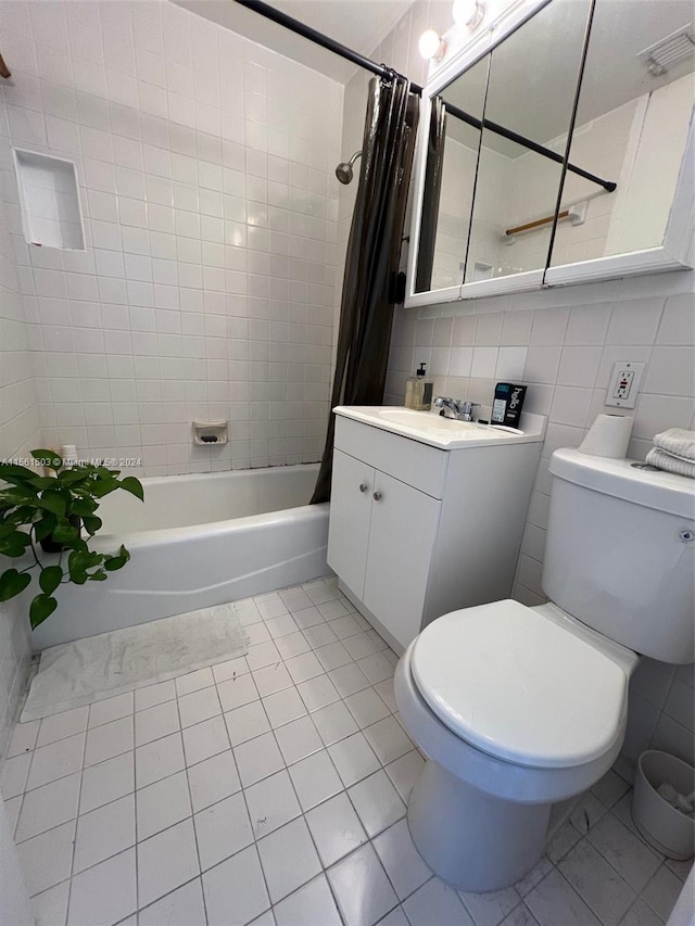 full bathroom with tile flooring, tile walls, tasteful backsplash, toilet, and vanity