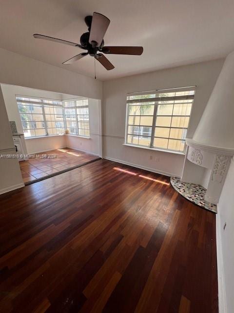 unfurnished room with hardwood / wood-style floors and ceiling fan