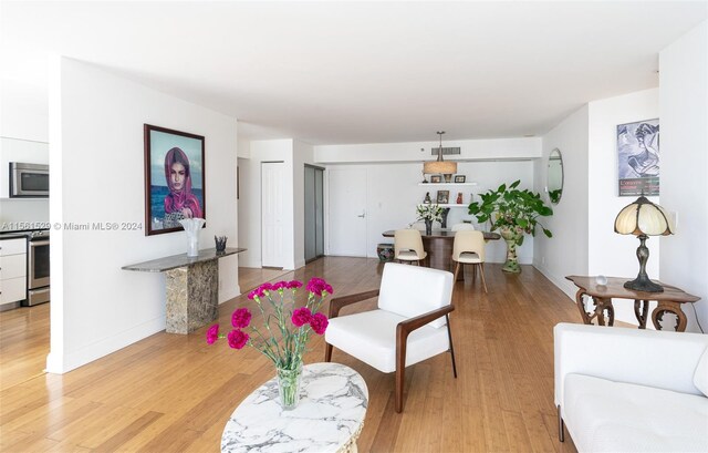 living room with light hardwood / wood-style floors