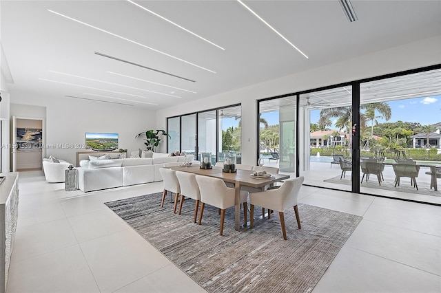 tiled dining area with a healthy amount of sunlight