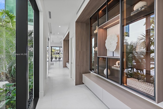 hallway with light tile patterned flooring