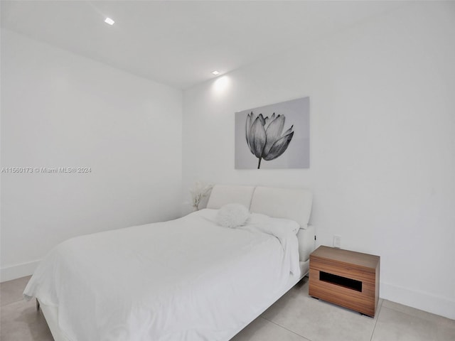 bedroom featuring light tile floors