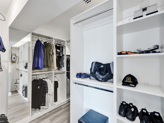 walk in closet featuring light hardwood / wood-style flooring