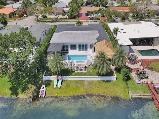 birds eye view of property featuring a water view