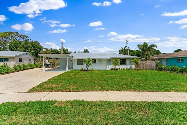 single story home with a front lawn and a carport