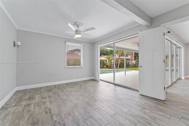 unfurnished room with ceiling fan, light hardwood / wood-style floors, and crown molding