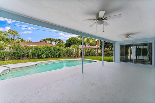 view of swimming pool with ceiling fan and a patio area