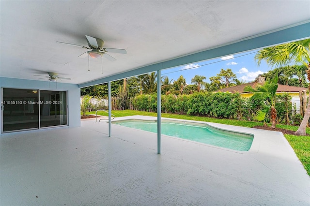 view of swimming pool with ceiling fan and a patio