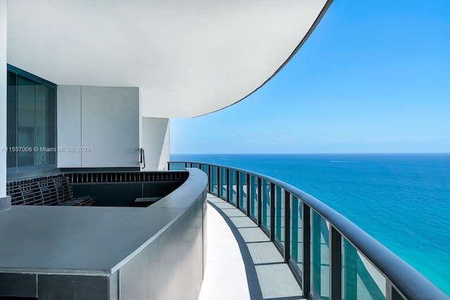 balcony featuring a water view