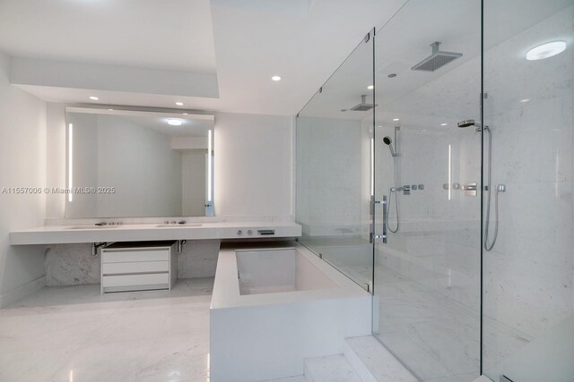 bathroom featuring independent shower and bath, vanity, and tile flooring