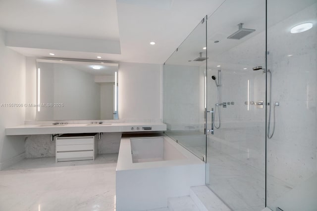 bathroom with vanity and a shower with shower door