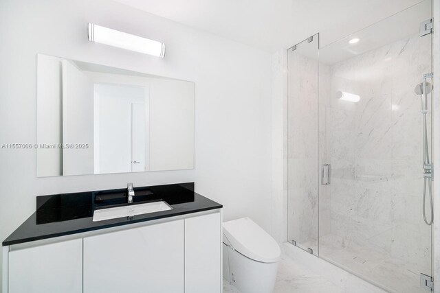 bathroom with vanity, an enclosed shower, and toilet